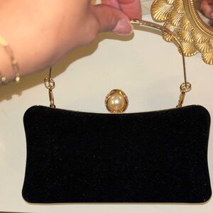 Elegant Black Clutch with Pearl Accent